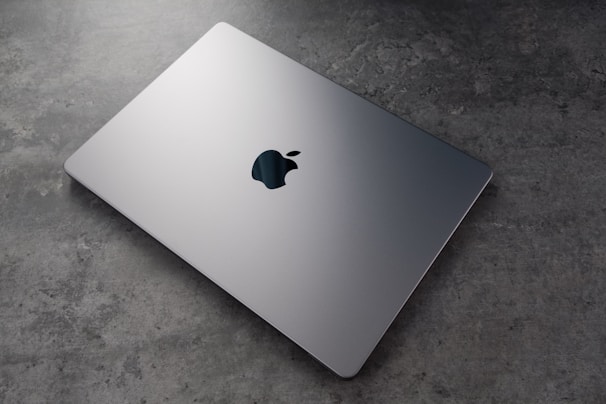 A sleek laptop displaying a domain marketplace interface with gottech branding.