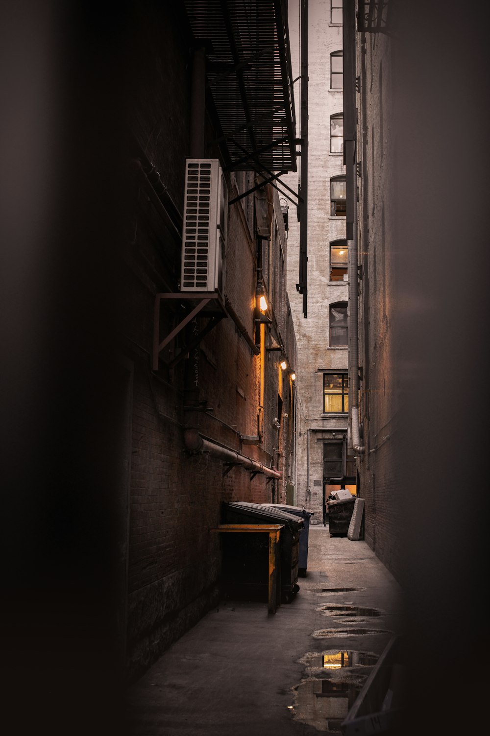 a narrow alleyway with a ladder