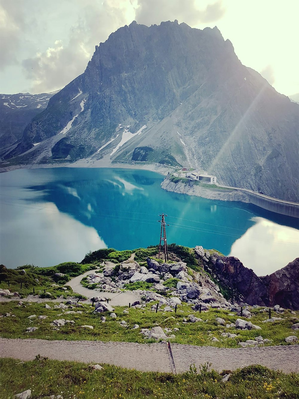 a mountain with a body of water below