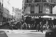 People enjoying a café terrace in Lille’s bustling city center.
