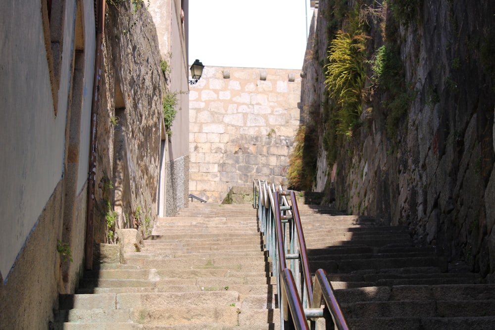 a stone walkway between stone buildings