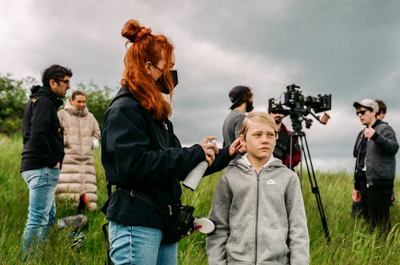 a person filming a person with a camera