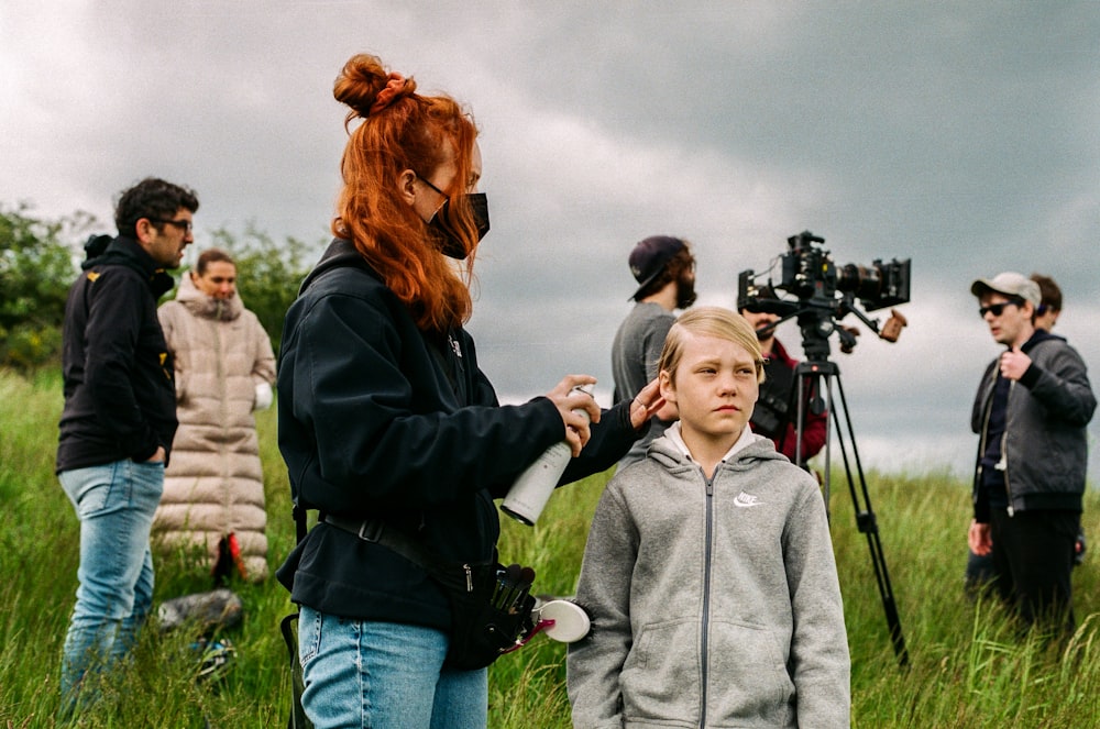 a person filming a person with a camera