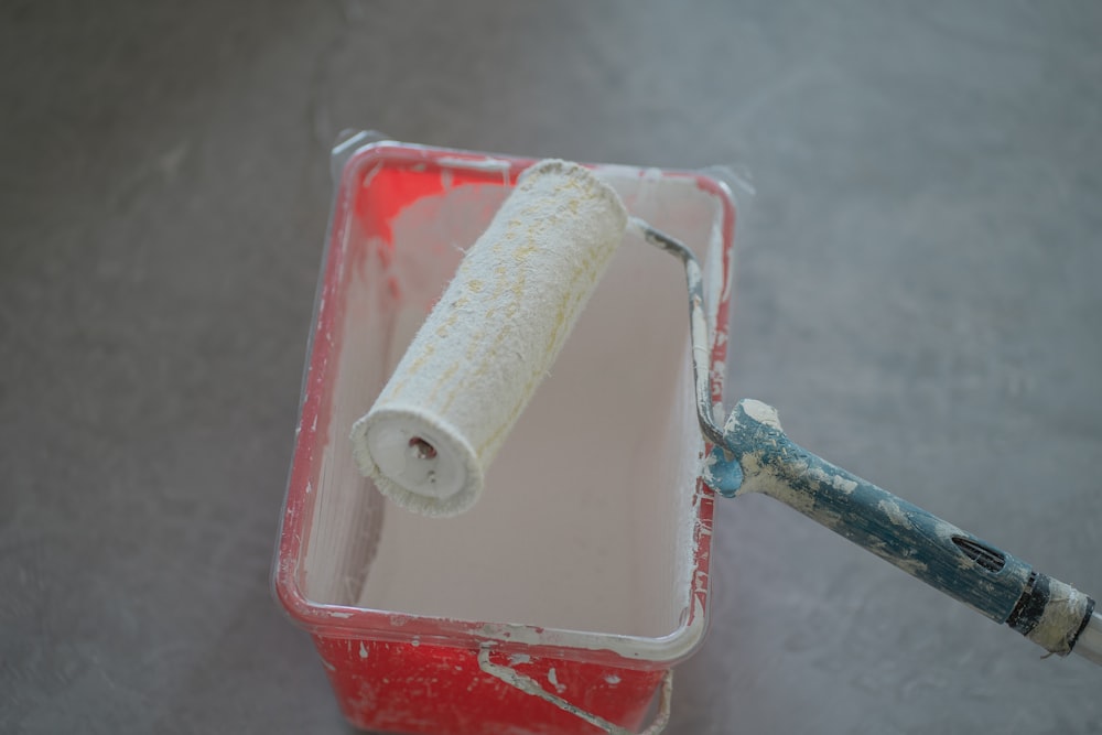 a toothbrush in a plastic container