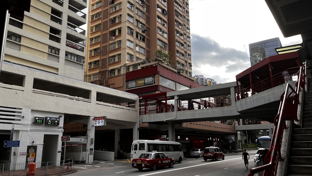 a street with cars and buildings