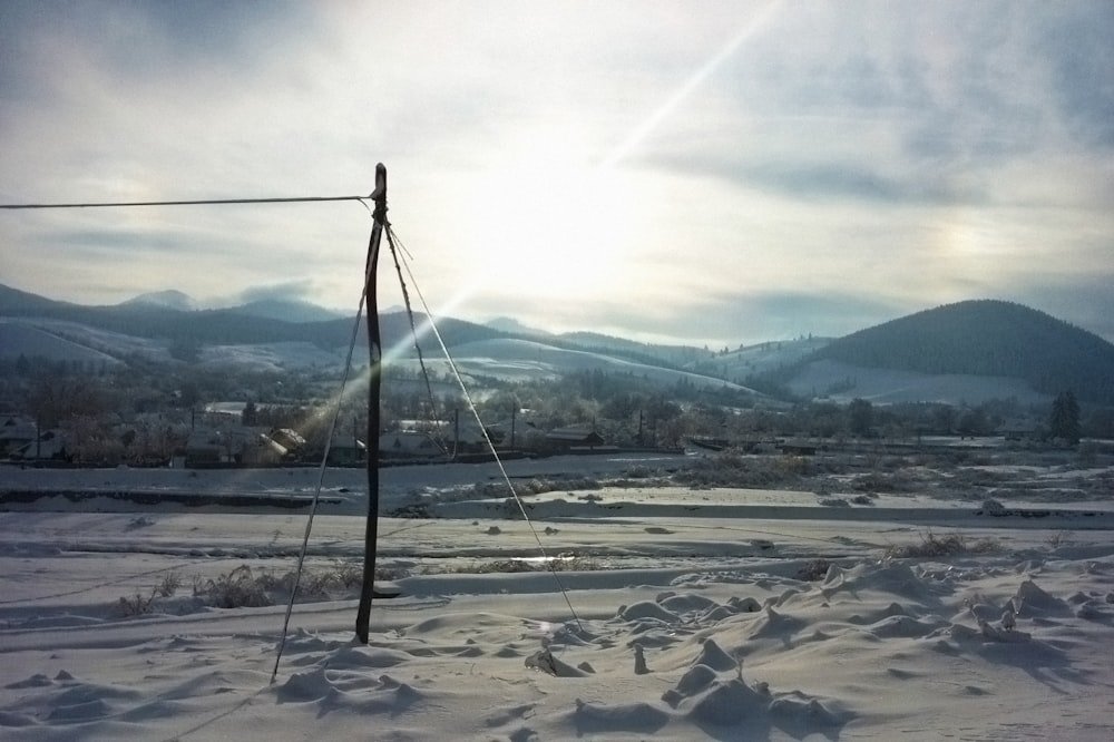 a snowy landscape with a power line
