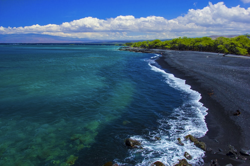 a beach with blue water