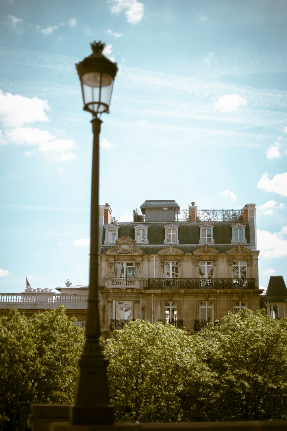 a lamp post in front of a building