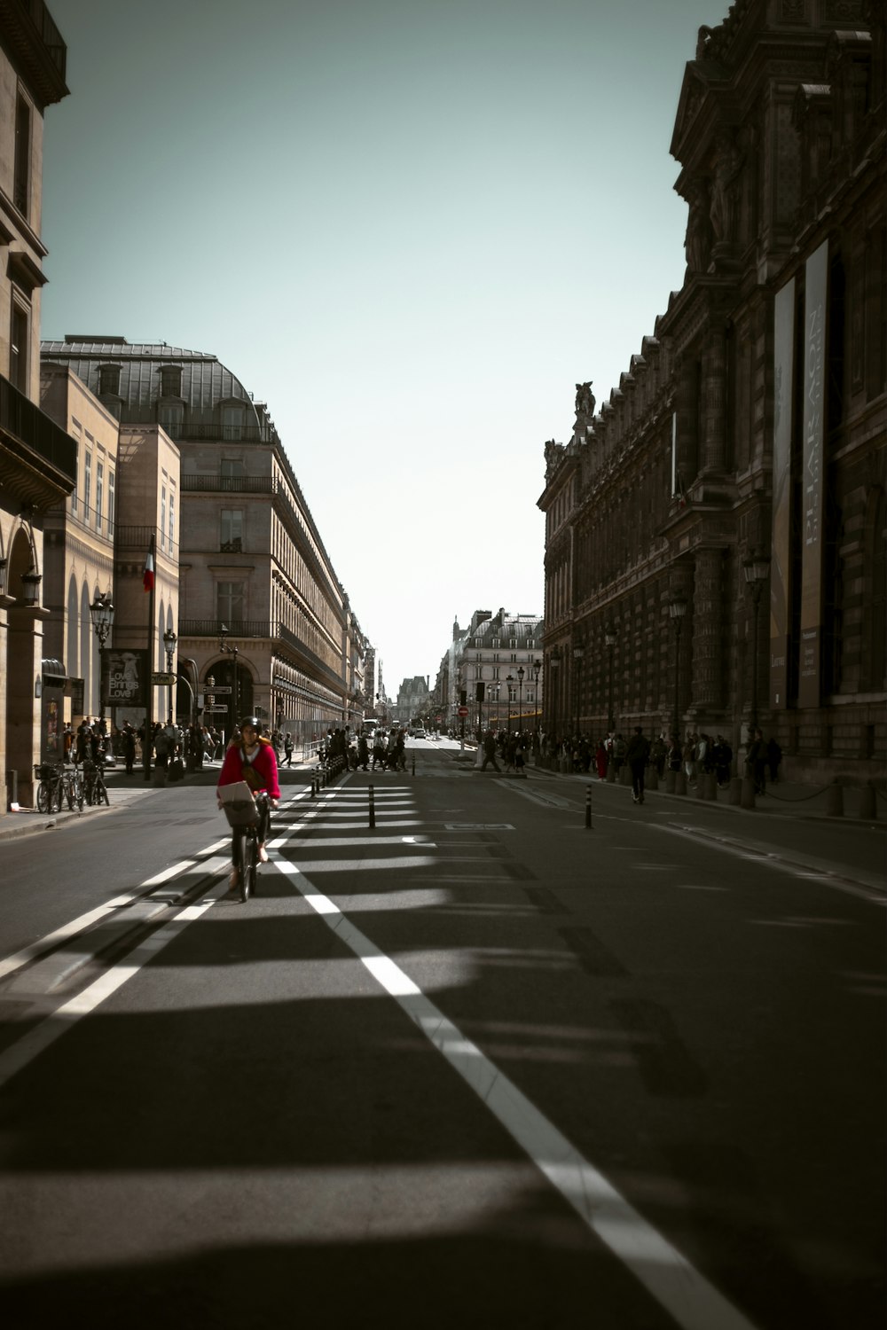 a person riding a bicycle on a city street