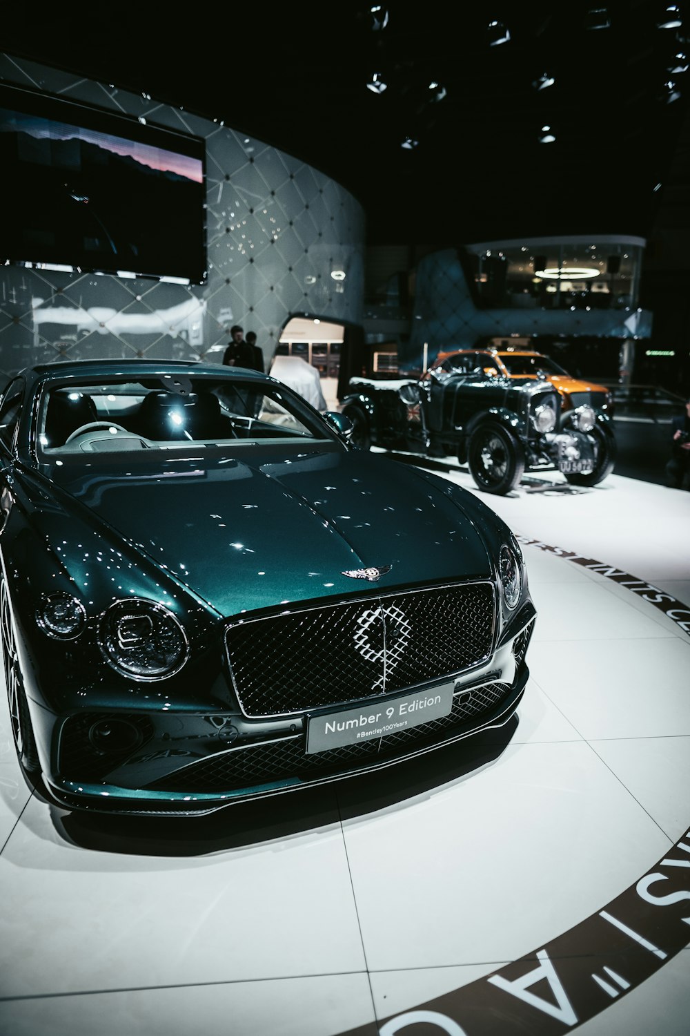 a black car parked in a showroom