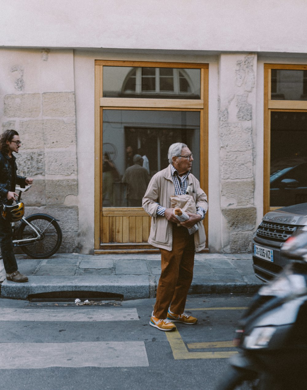 a man standing on the sidewalk