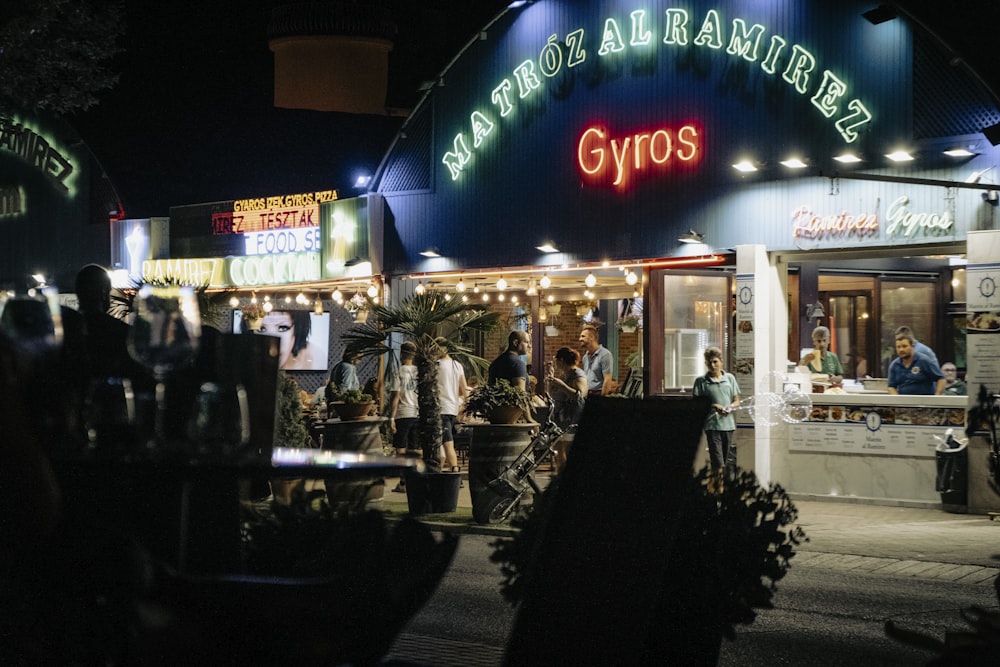 a group of people outside a restaurant