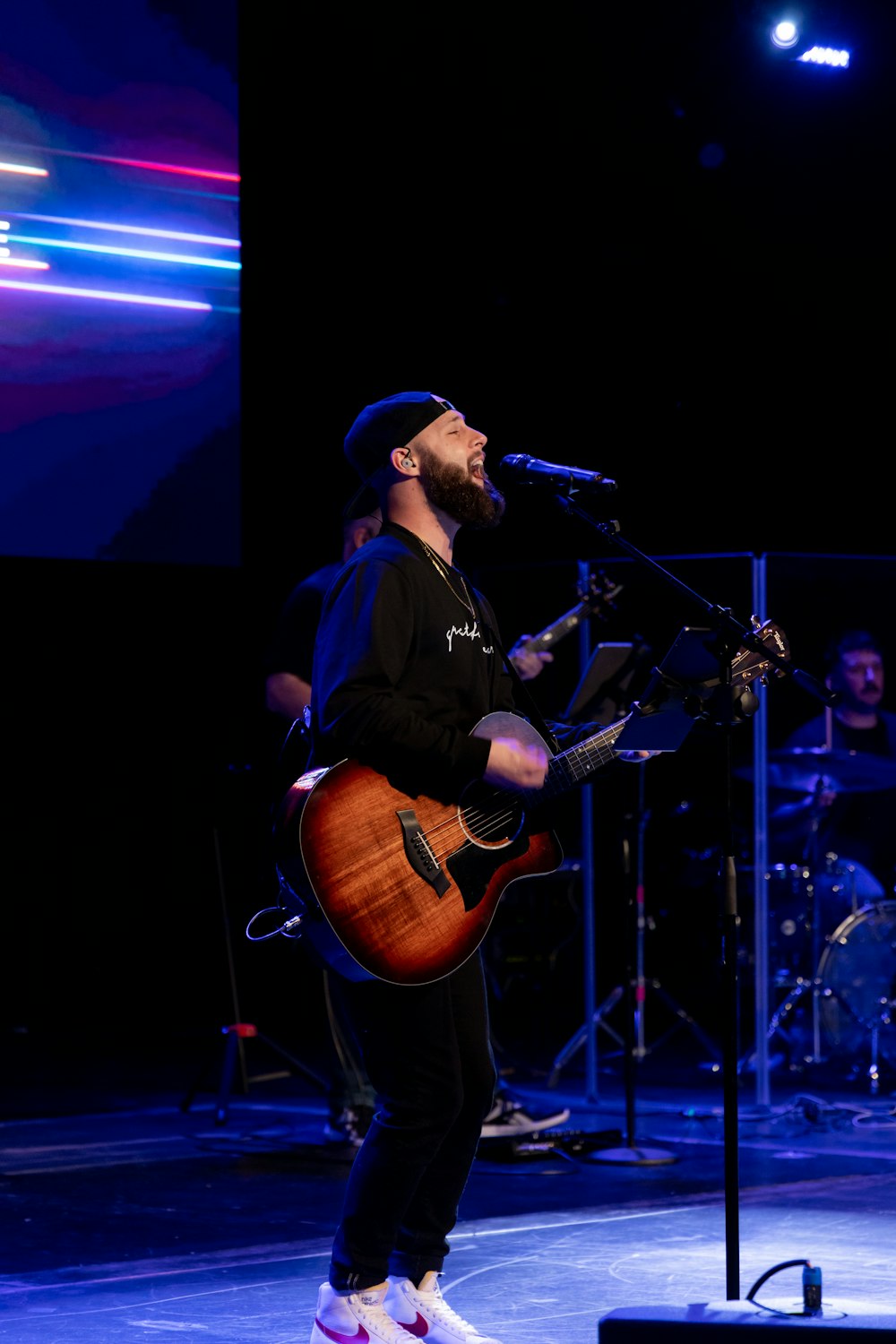 a person playing a guitar on a stage