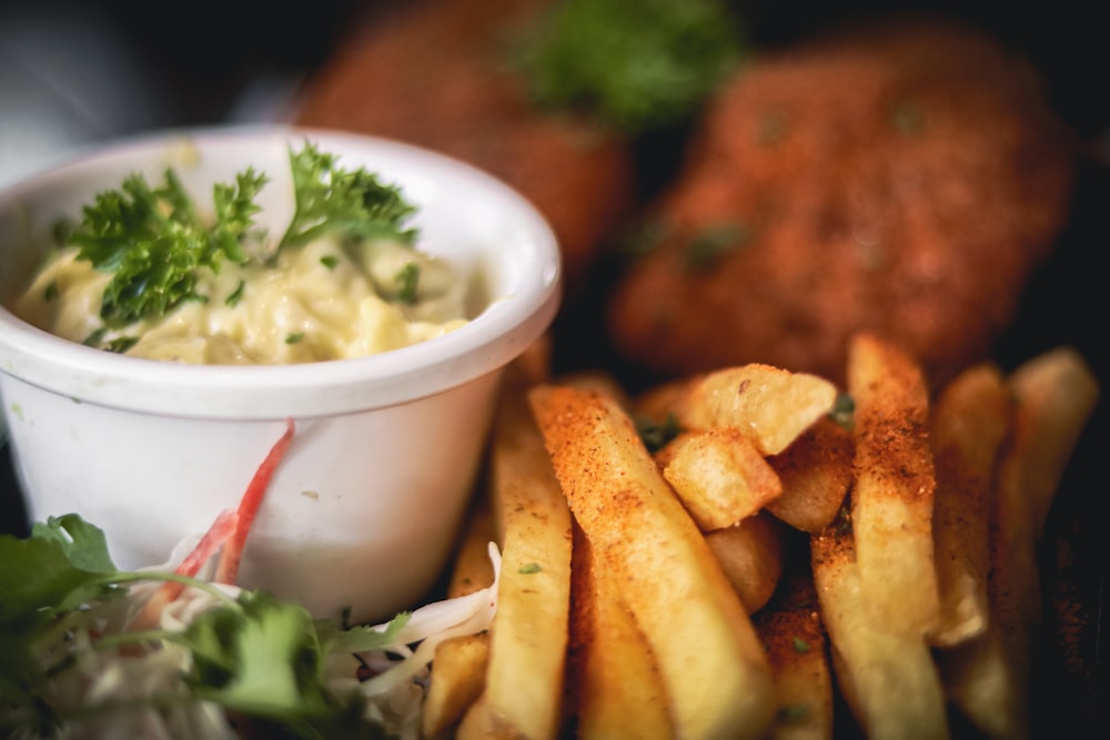 a bowl of food next to a bowl of food