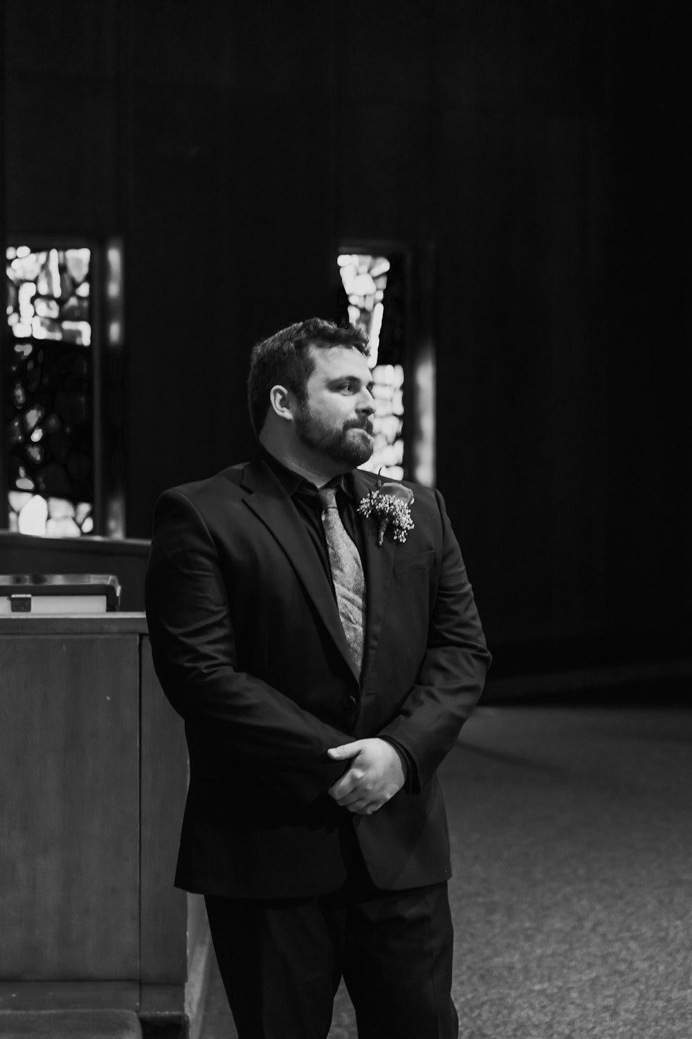 a man in a suit holding a sword