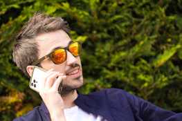 a man talking on a cell phone
