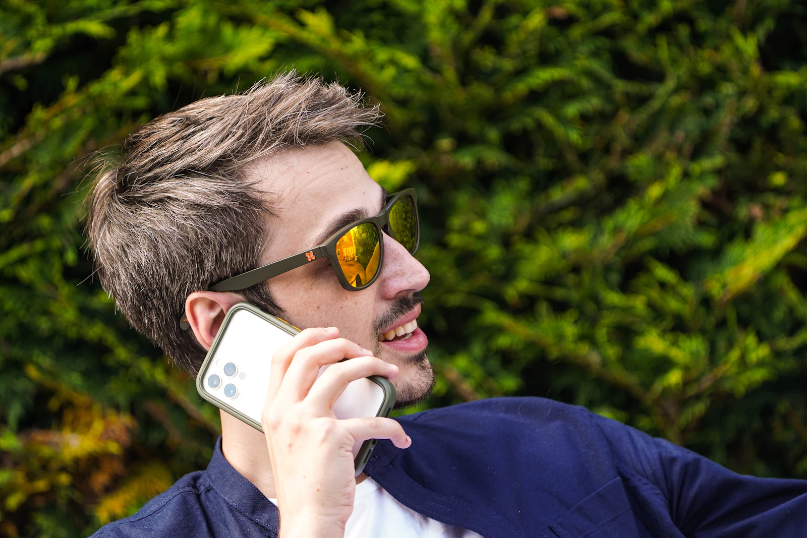 A person speaking into their smartphone to capture a task by voice