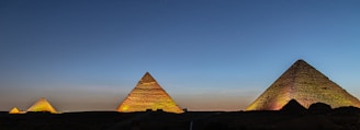pyramids in a desert with Giza pyramid complex in the background