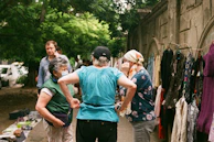 A team member chatting warmly with a local vendor during a destination scout.