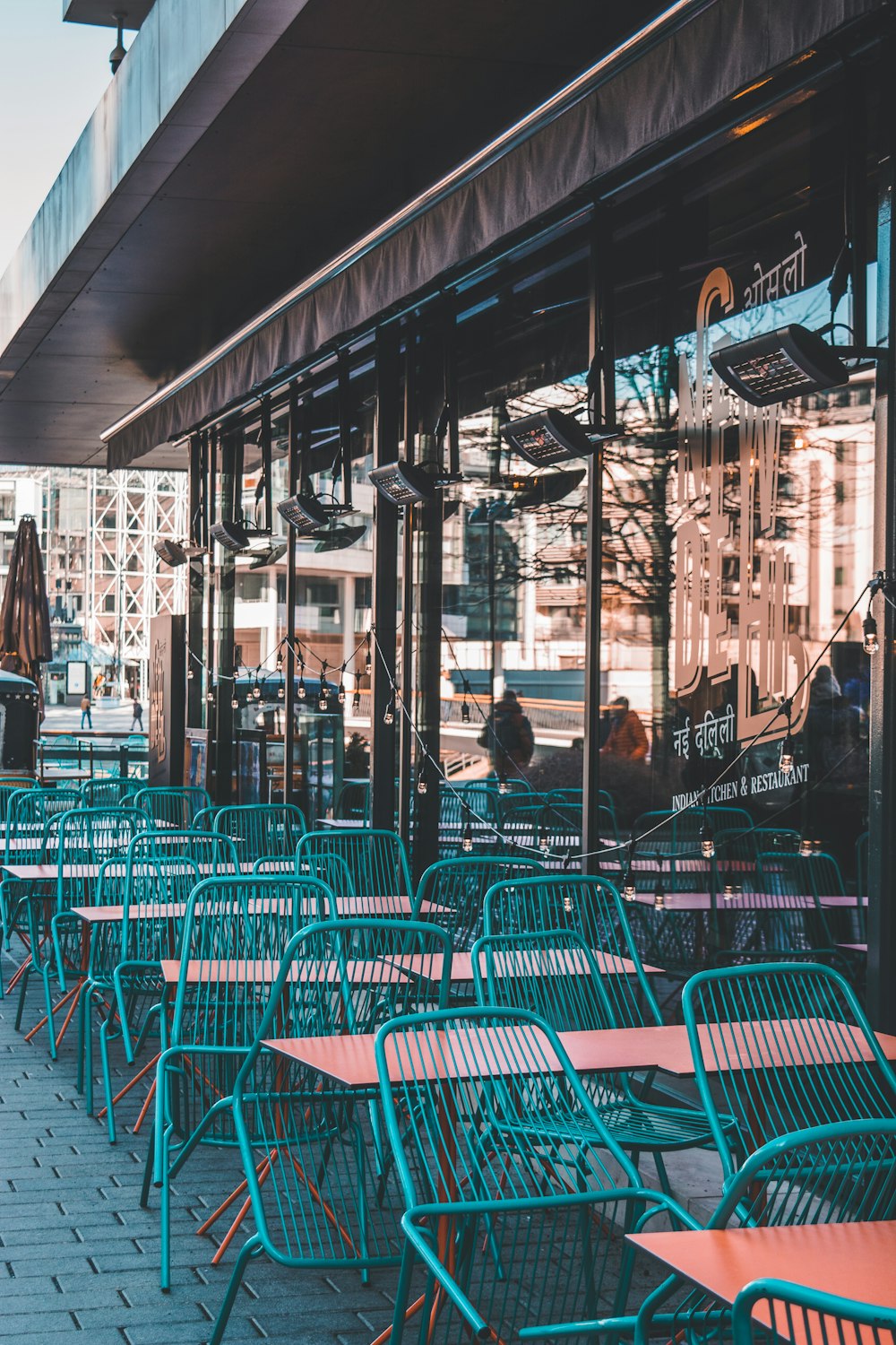 a group of tables and chairs outside