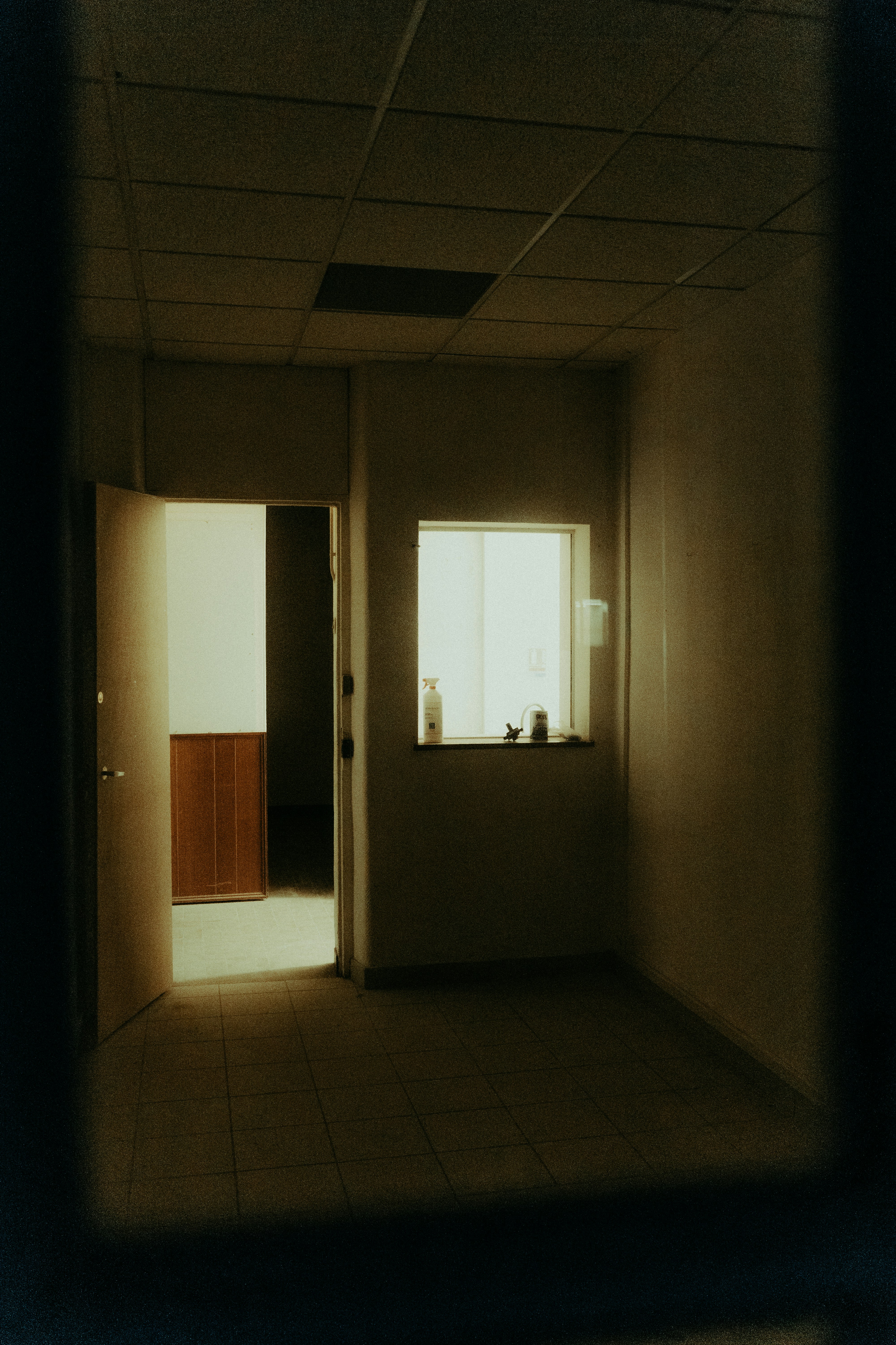 a room with a mirror and a shelf with a light on it