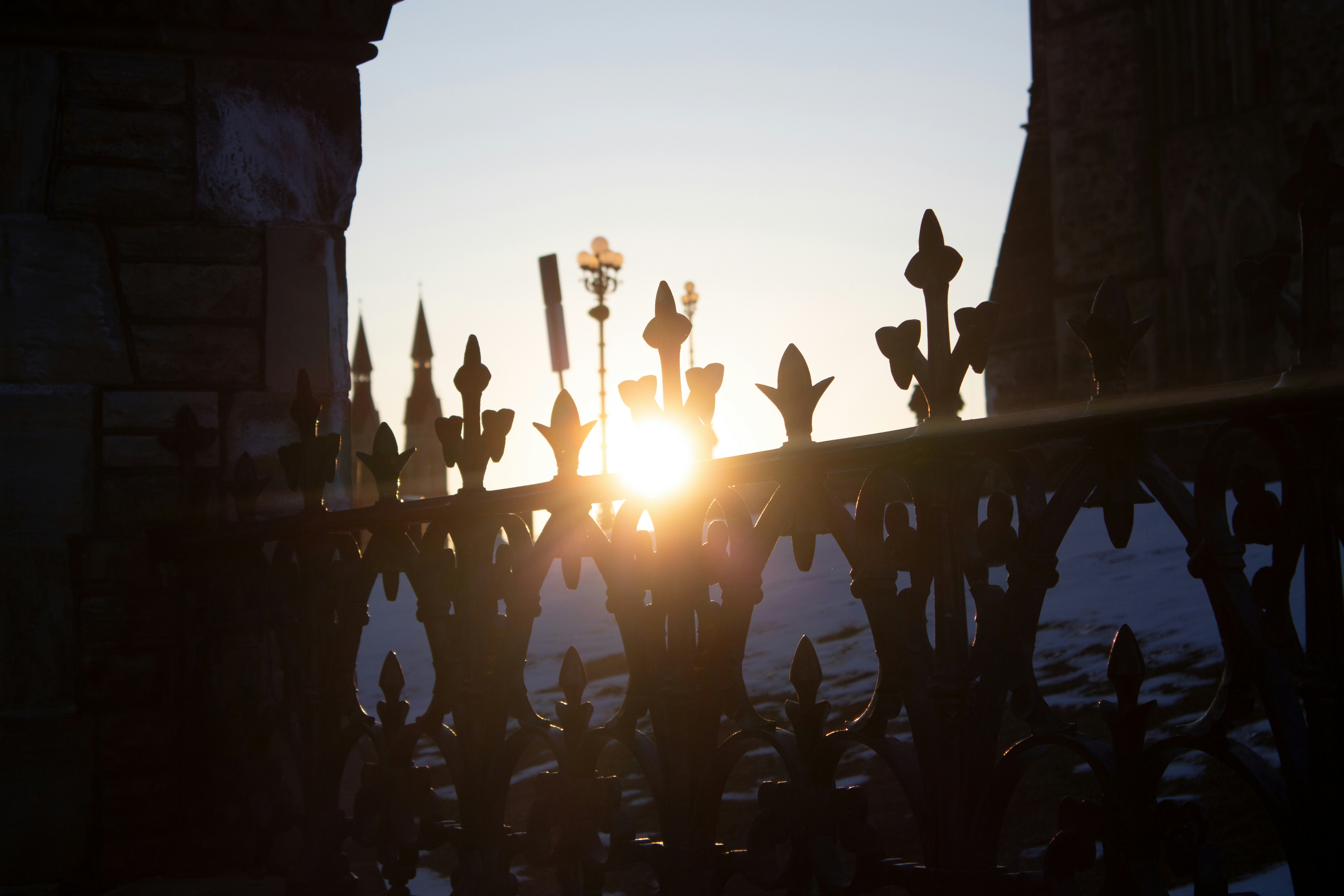 a group of candles on a fence
