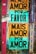 A wall covered with colorful graffiti and posters. Two prominent posters with large black text on multicolored backgrounds. One reads 'Menos Amor Por Favor' and the other 'Mais Amor Por Amor'. The wall also has various other small stickers and graffiti in different colors, mainly purple and teal.