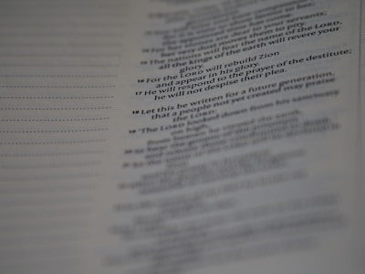 Close-up of an open book page with a highlighted memorable quote in elegant serif font.