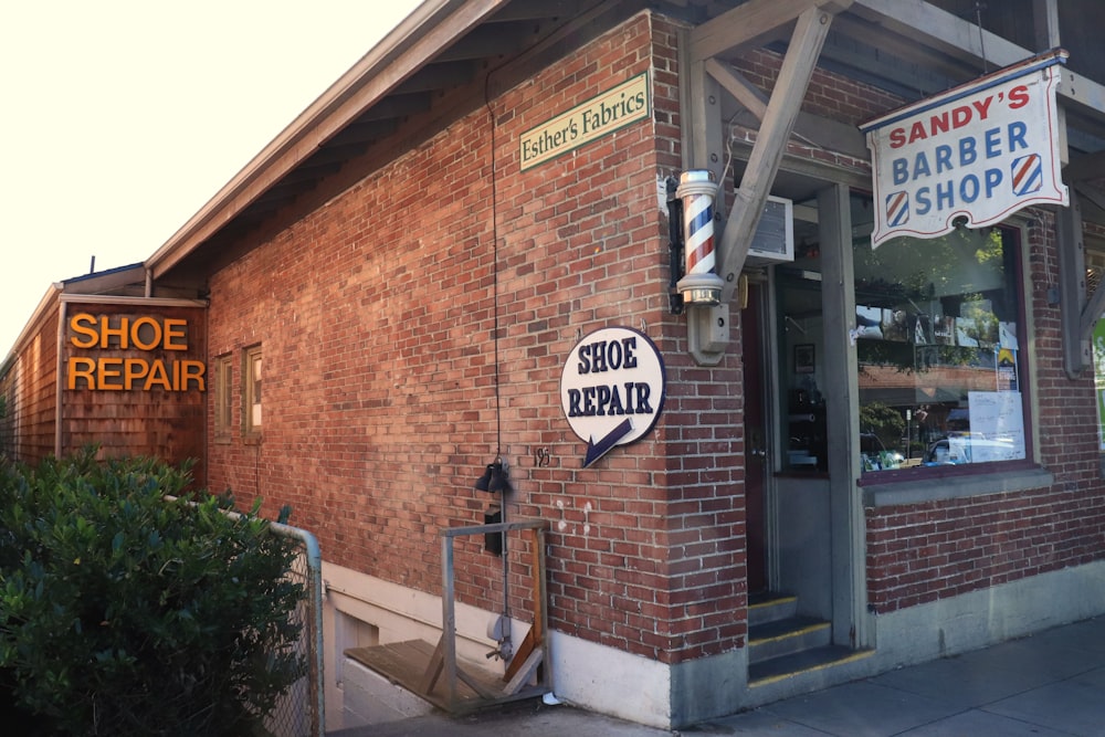 a brick building with signs