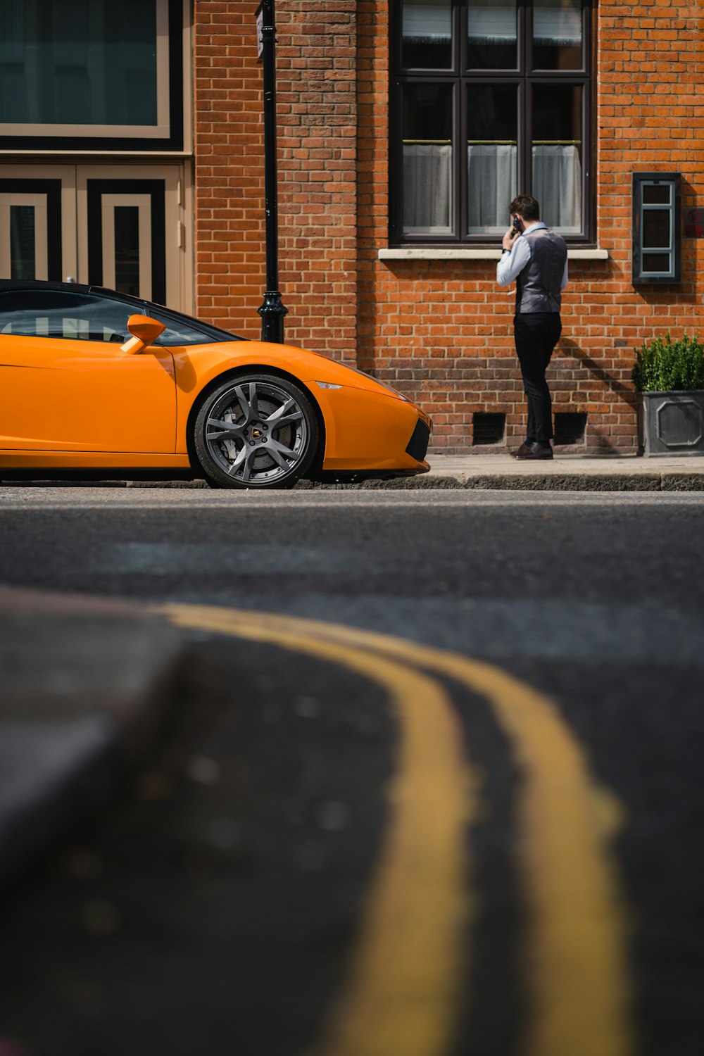 a person standing next to a car