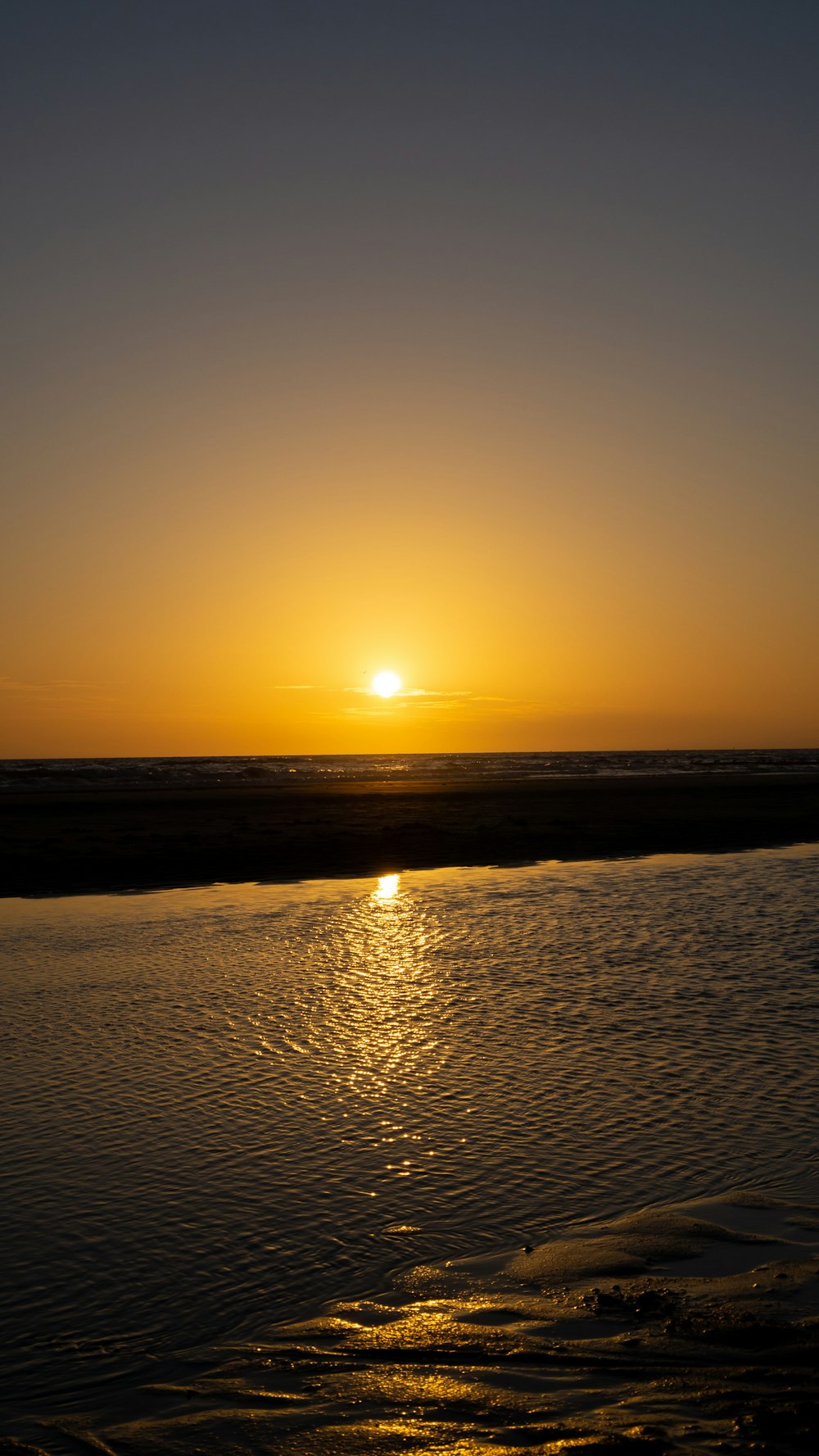 a sunset over a beach