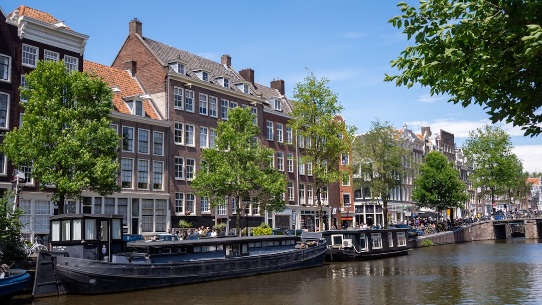 a canal with boats and buildings along it,