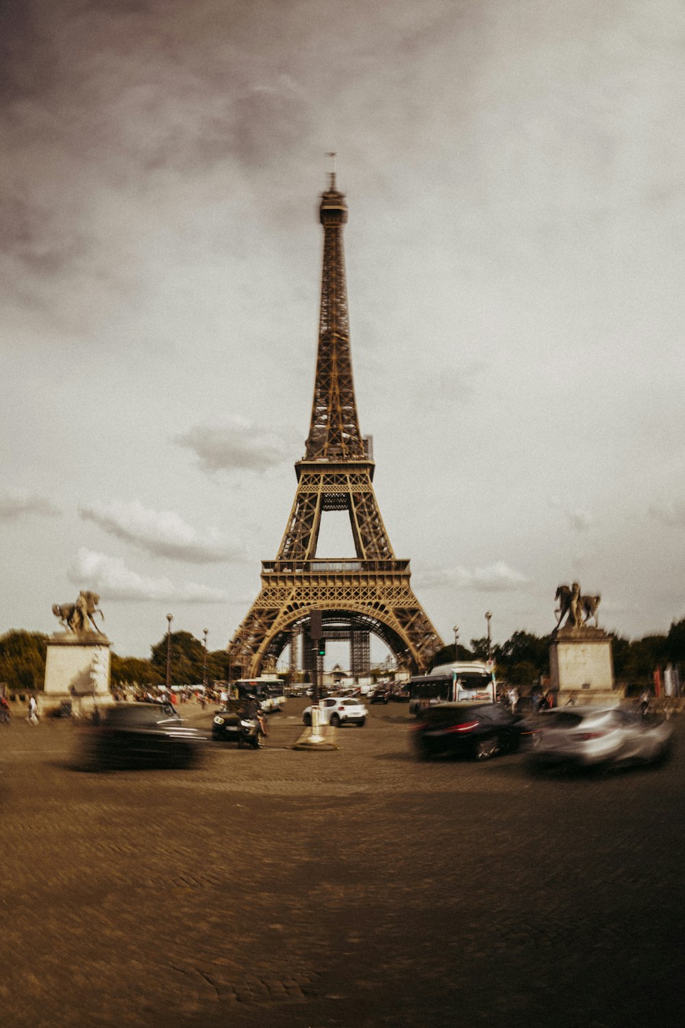 a large tower with cars parked below