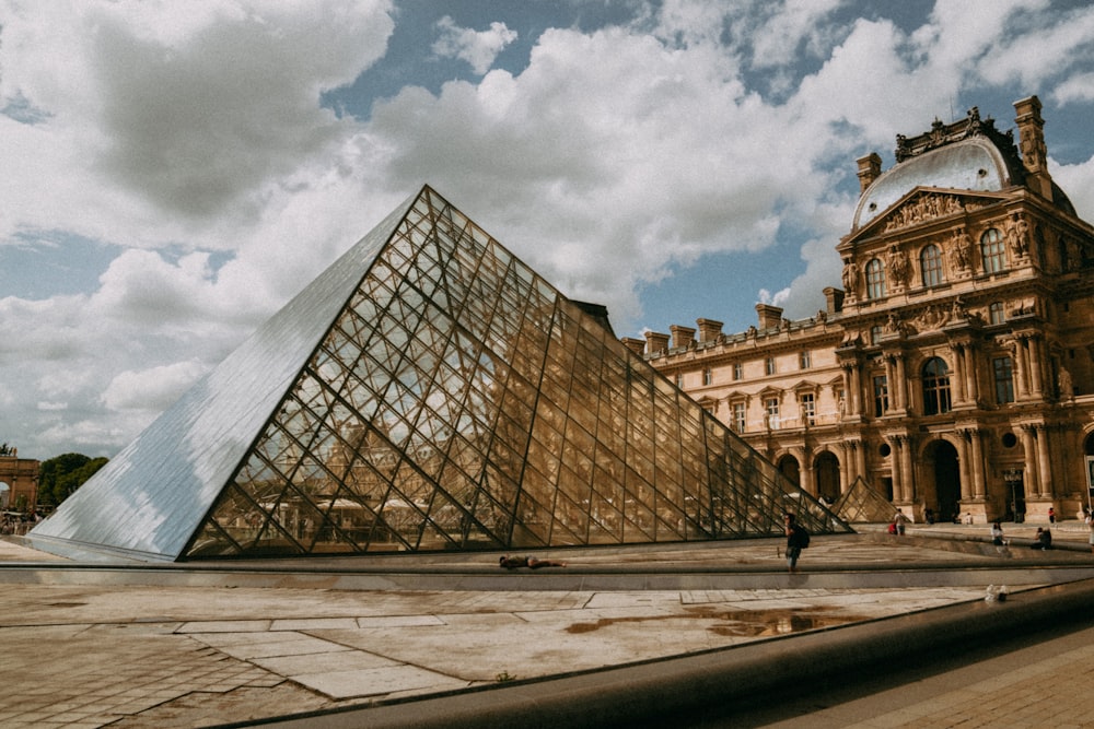 a large glass building with a glass front