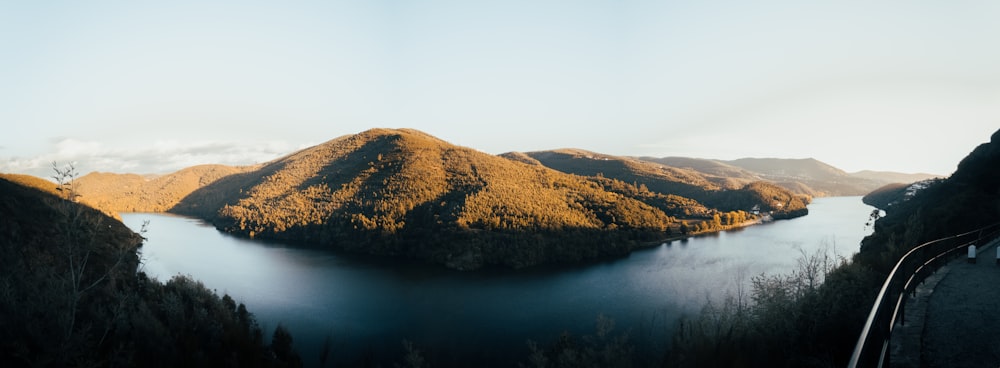 a body of water with hills around it