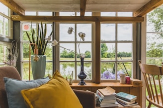 a living room filled with furniture and a large window