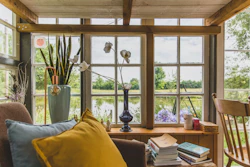 a living room filled with furniture and a large window