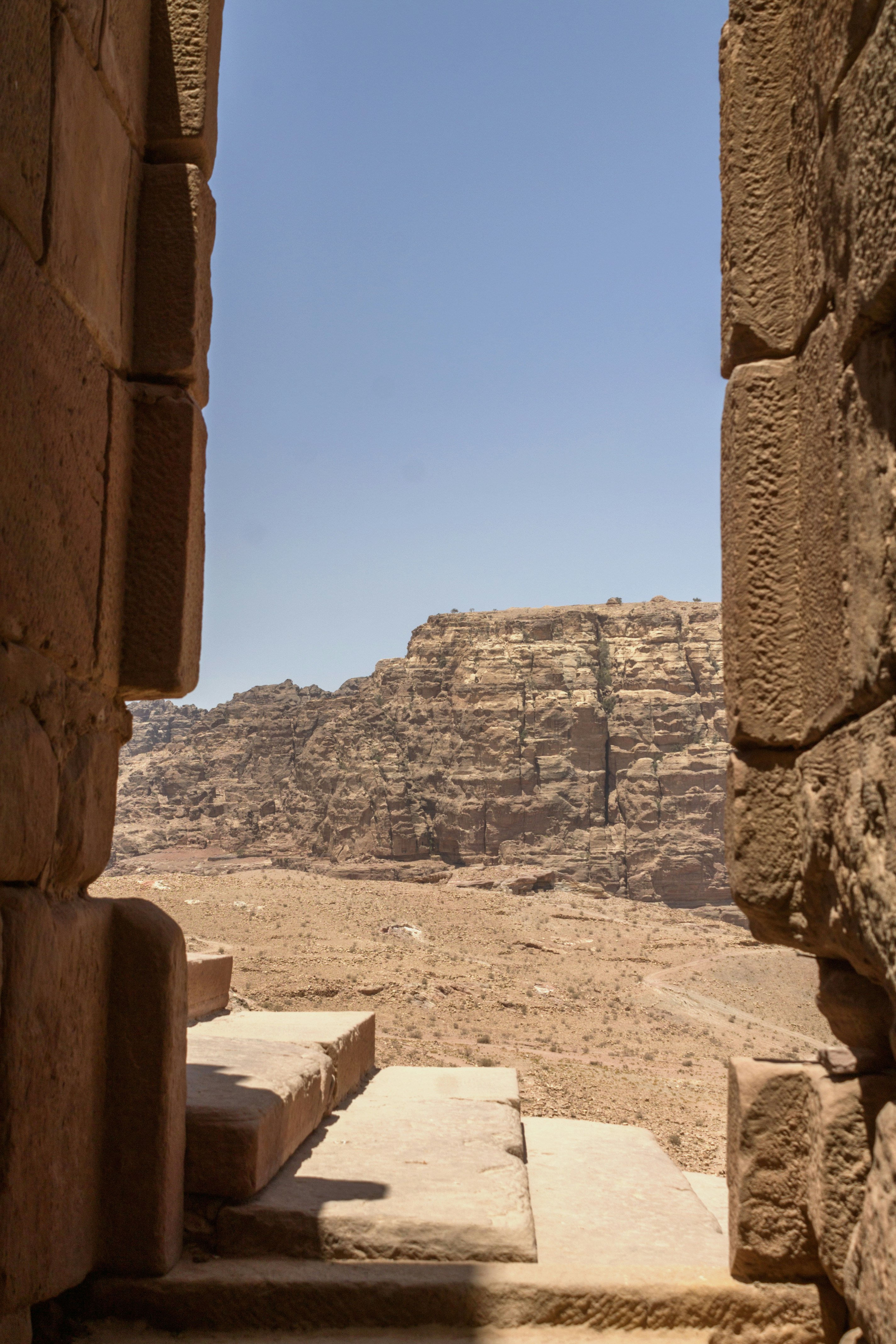 a stone staircase leading up to a canyon