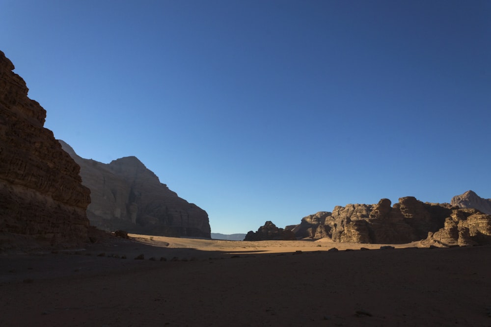 a desert landscape with a blue sky