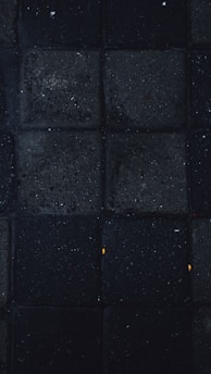 Dark-themed patches and buffs laid out on a black surface with subtle red highlights