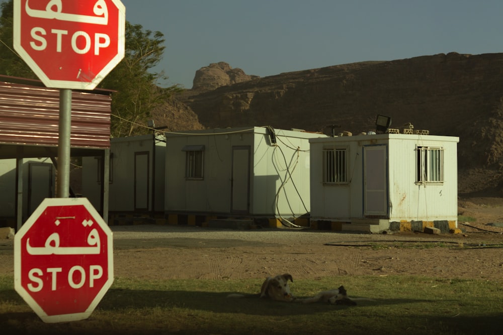 a stop sign next to a building