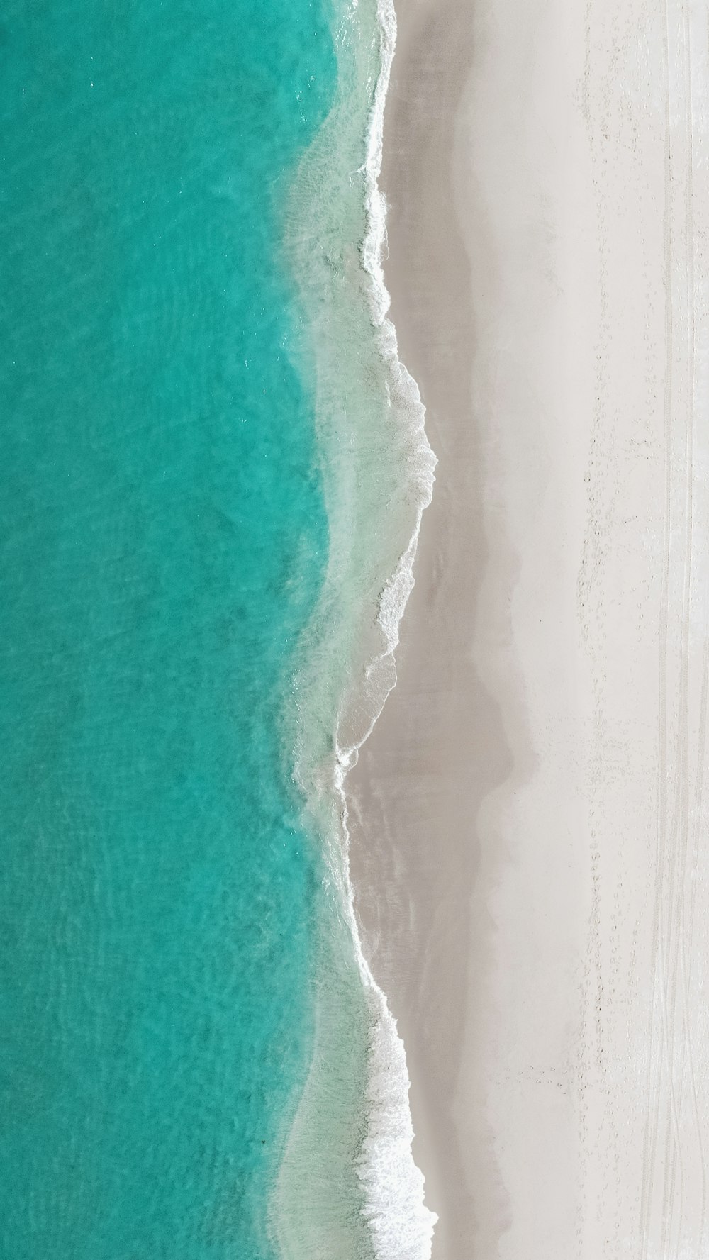 a white wave on a blue surface