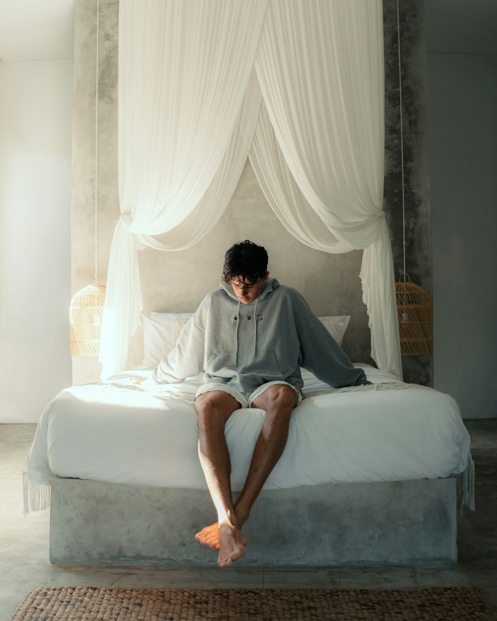 a man sitting on a bed