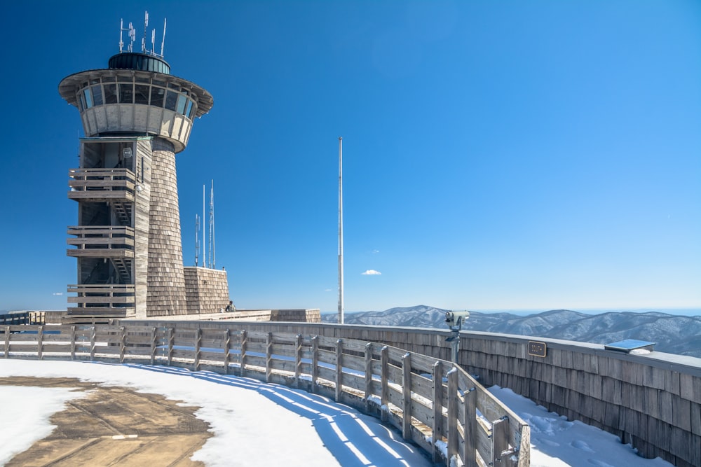 a large tower with a fence around it