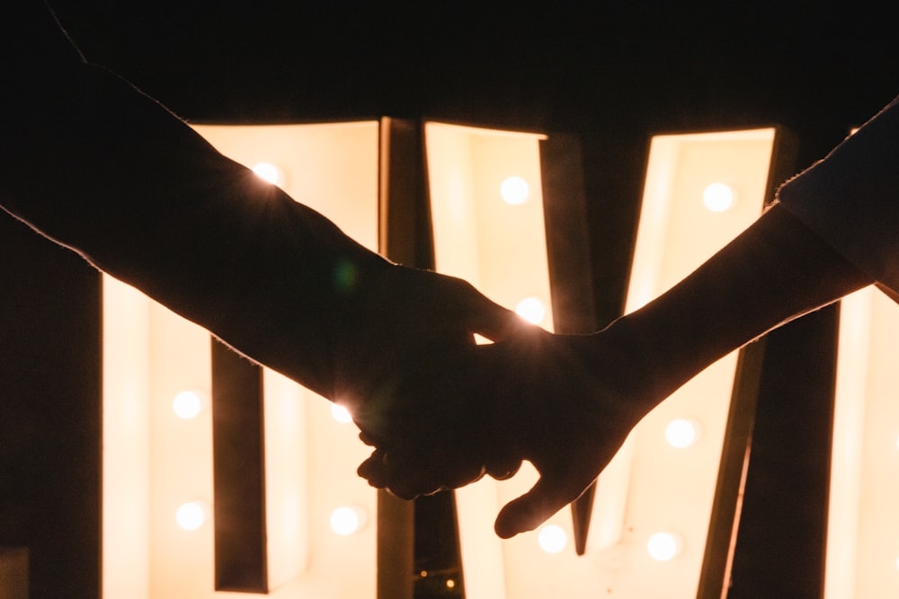 a hand holding a light