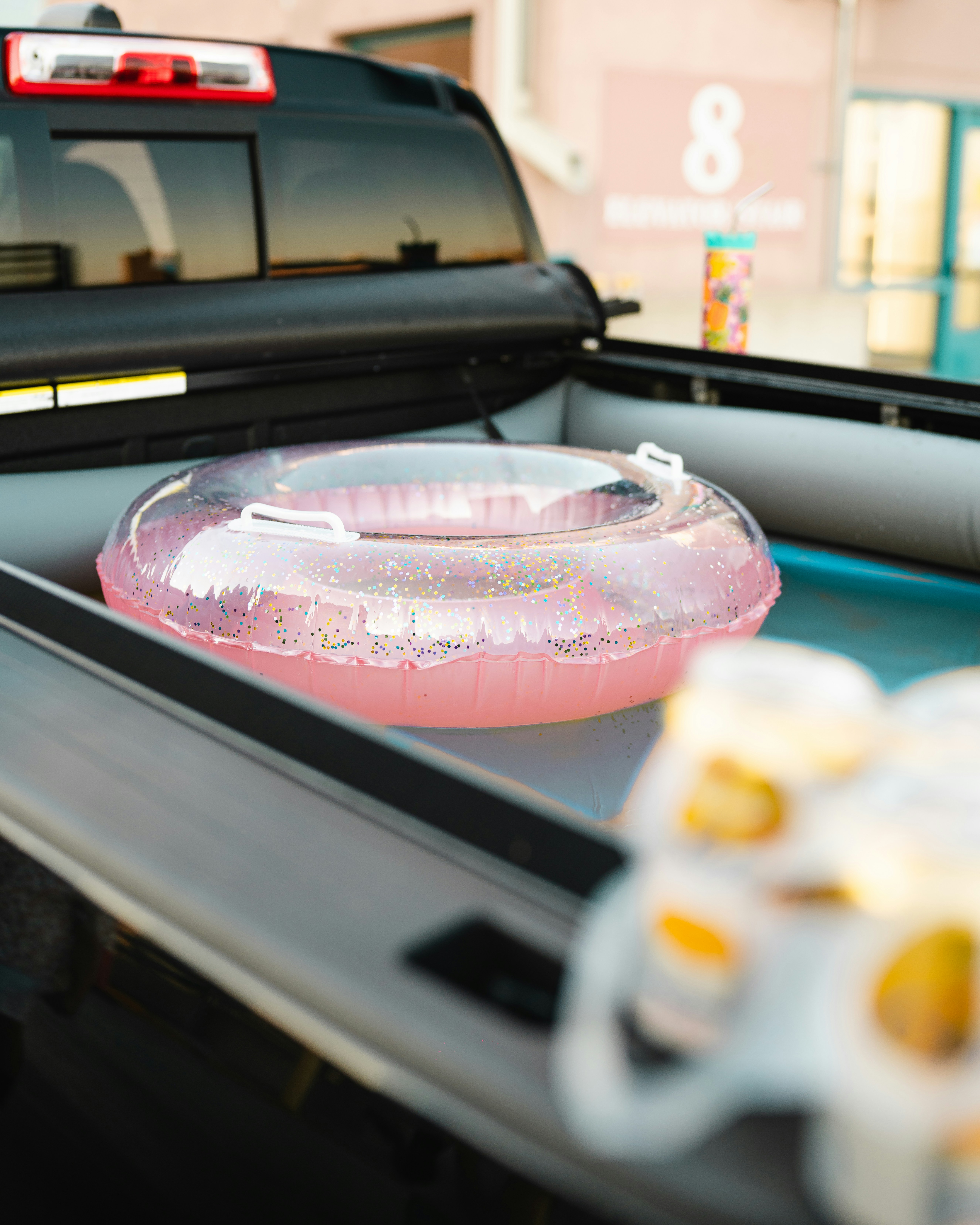 a car with a pink object in the front