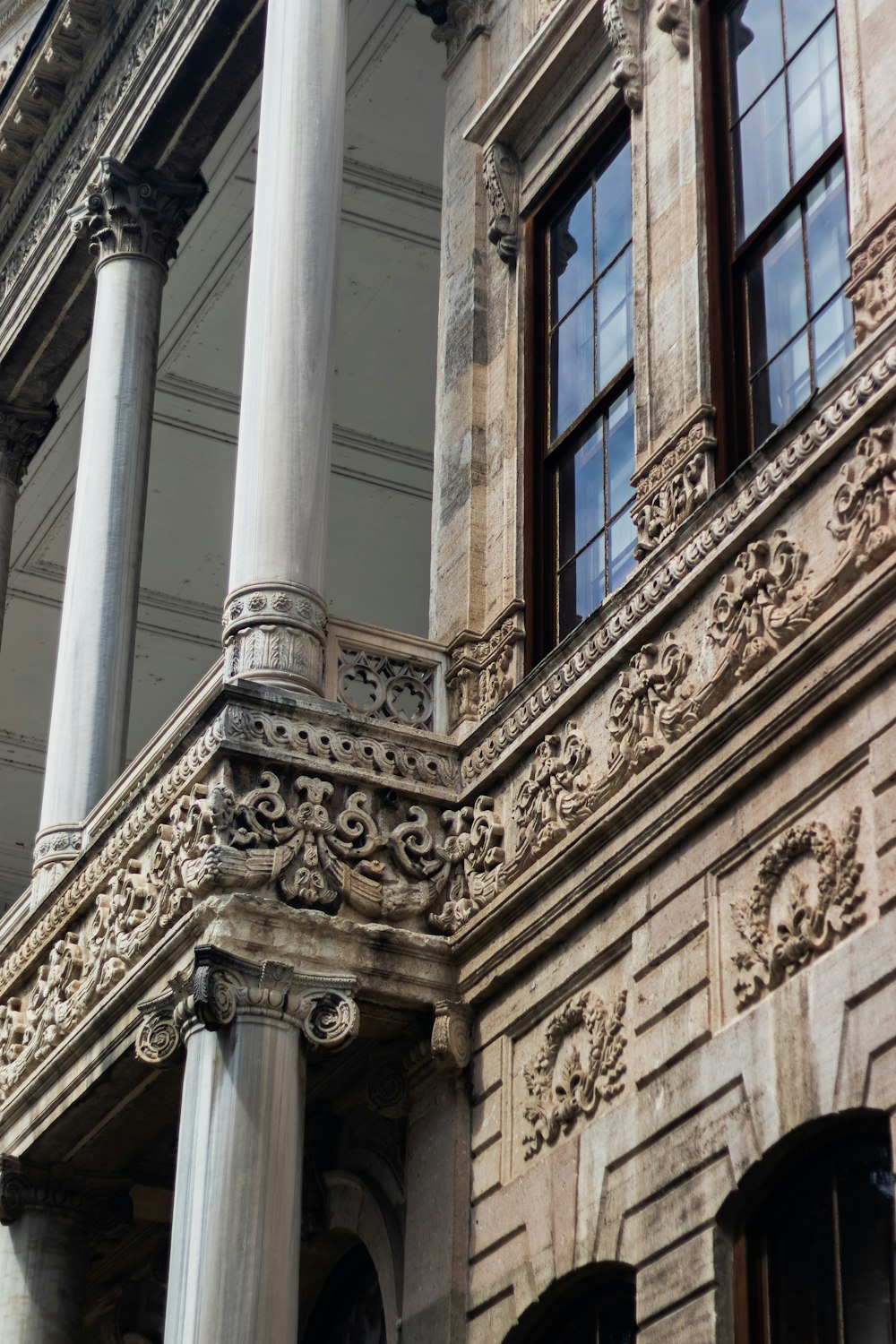 a building with pillars and windows