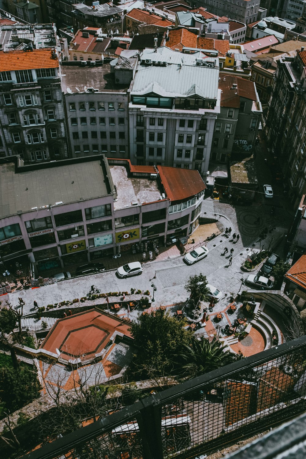 a group of buildings with a road in the middle