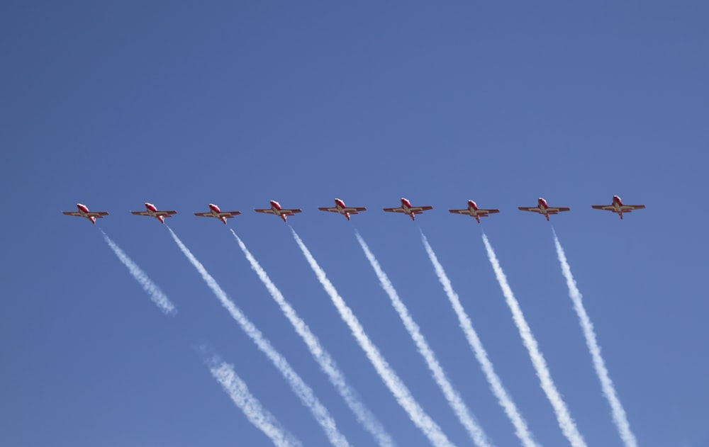 a group of airplanes flying in formation