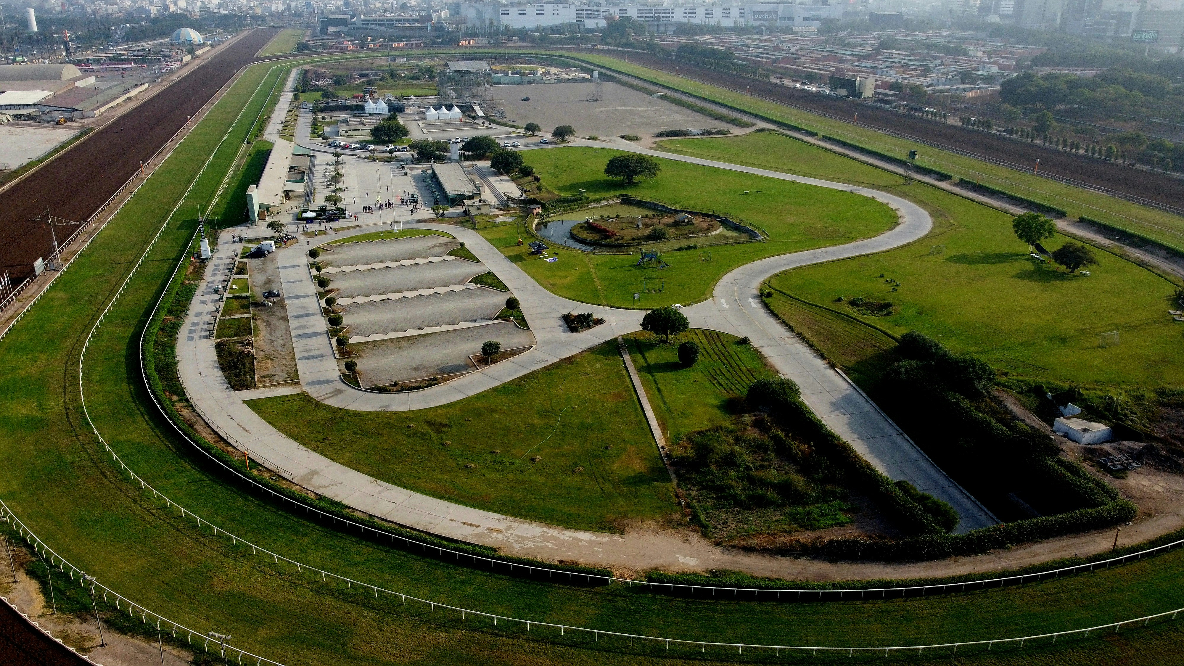 an aerial view of a large green field